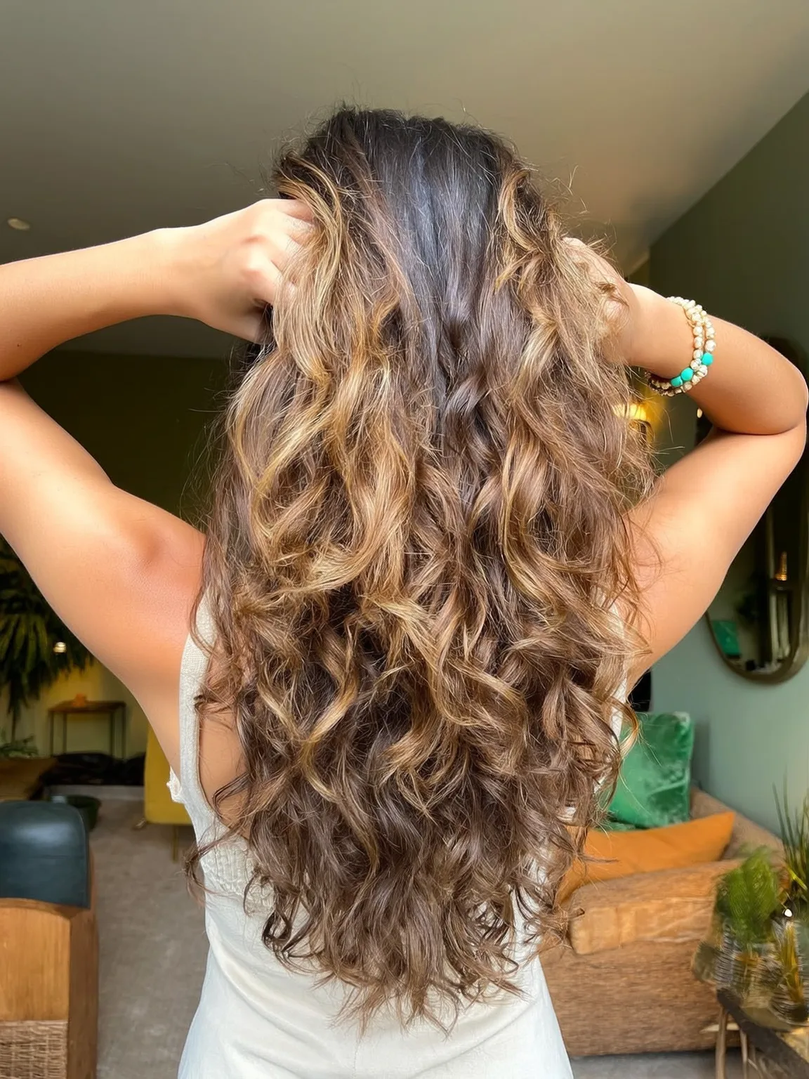 Long Curly Layers in Honey Brown with Caramel Highlights
